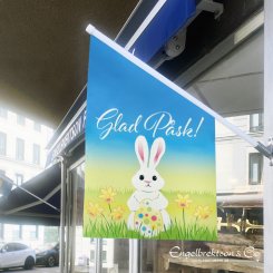 Färgglad påskflagga butiksflagga med hare och påskägg